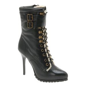 NWOT. Aldo lace up boot with Sherpa lining, side zipper, and 4.5” stiletto heel.